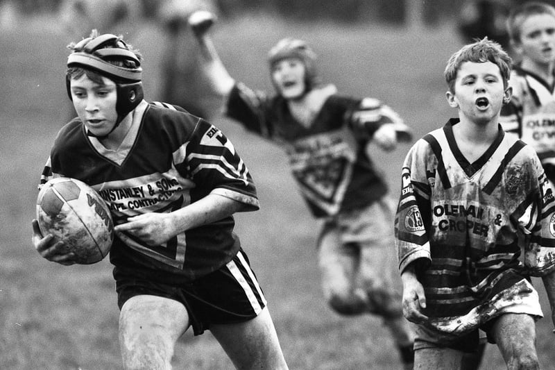 Ashton Bears Under 12s on their way to another try in a 22-12 defeat of Leigh Rangers in a junior rugby league match at Low Bank Road, Ashton, on Sunday 27th of November 1994.