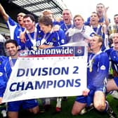 Latics celebrate with the Division 2 championship trophy after beating Barnsley 1-0 with a Tony Dinning goal  on Saturday 3rd of May, the last day of the 2002/2003 season. 
