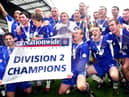 Latics celebrate with the Division 2 championship trophy after beating Barnsley 1-0 with a Tony Dinning goal  on Saturday 3rd of May, the last day of the 2002/2003 season. 