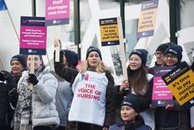 Nurses braving freezing temperatures to form a picket line.