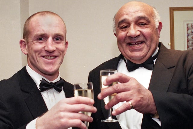 Wigan Rugby League Club legends Shaun Edwards and Billy Boston share a toast as they are the first two players to be honoured in the club's new Hall of Fame at a dinner held at Wrightington Country Club on Thursday 19th of March 1998.