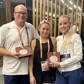 Keely Hodgkinson celebrates her World Championship silver medal with coaches Trevor Painter and his wife Jenny Meadows