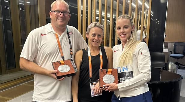 Keely Hodgkinson celebrates her World Championship silver medal with coaches Trevor Painter and his wife Jenny Meadows