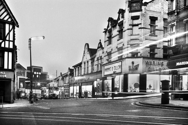 A night picture looking down Station Road with Waring and Gillow furniture store and Oxleys departmental store on the right and the Ritz cinema and Court school of dancing at the bottom of the road in the late 1960s.  Between Oxleys and Waring and Gillow could be John Peters furniture store but I can't make out the name.