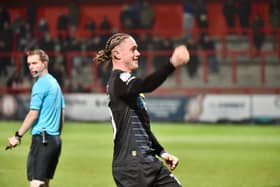 Thelo Aasgaard celebrates his winning goal for Latics at Stevenage