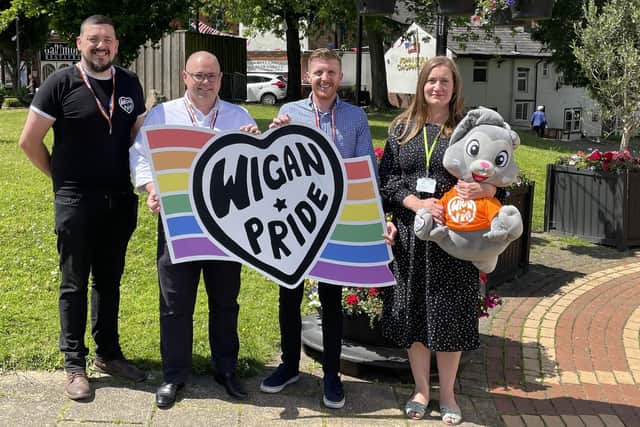 Scott Williams, from Wigan Pride, with WWL's Paul Howard and Joseph Usher, and Coun Laura Flynn