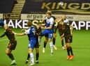 Charlie Wyke goes up for a header against Stoke
