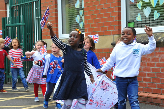 Staff and pupils at Mab's Cross primary school, Wigan, parade around the school, part of celebrations for the Queen's platinum jubilee.