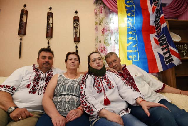 Ukrainian couple Ruslan Vorozhkin, left, and Svitlana Vorozhkina, second from right, who have lived in Wigan for over 12 years, are delighted to welcome Svitlana's refugee parents Ganna and Sergii, right,  who fled the war in Ukraine, but are unhappy at the lack of support they have.  They also want help to send emergency and medical items to people who are still in Ukraine.