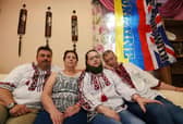 Ukrainian couple Ruslan Vorozhkin, left, and Svitlana Vorozhkina, second from right, who have lived in Wigan for over 12 years, are delighted to welcome Svitlana's refugee parents Ganna and Sergii, right,  who fled the war in Ukraine, but are unhappy at the lack of support they have.  They also want help to send emergency and medical items to people who are still in Ukraine.