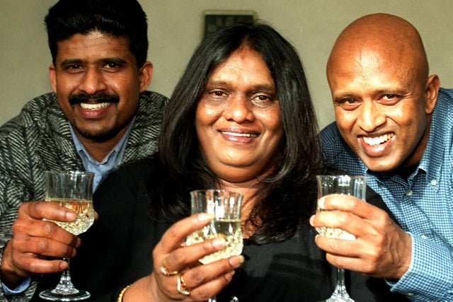 "Cheers"  Victoria  Nesarajah with John Mahilrajan and  Joseph  Nesarajah who are sharing the  £95,000  Mecca Bingo win.