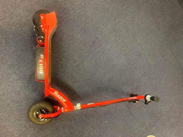 A red Razor scooter. Who is the rightful owner?
