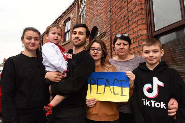 WIGAN - 21-03-22
Ukrainian Alina Podolian lives in Wigan, some of her family have fled the war in Ukraine and are now living with her, from left, Inna Hashynskyi (sister), Noah, two, (son), Faisal Khan (boyfriend), Alina Podolian, Yuliia Podolian (mum) and Artem Hashynskyi, ten, nephew.