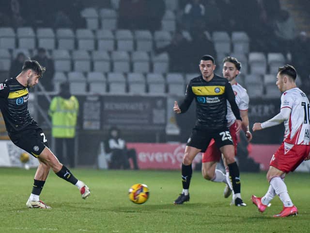 Ollie Norburn watches Harry McHugh play a pass during the on-loan Blackpool man's debut for Latics on Saturday