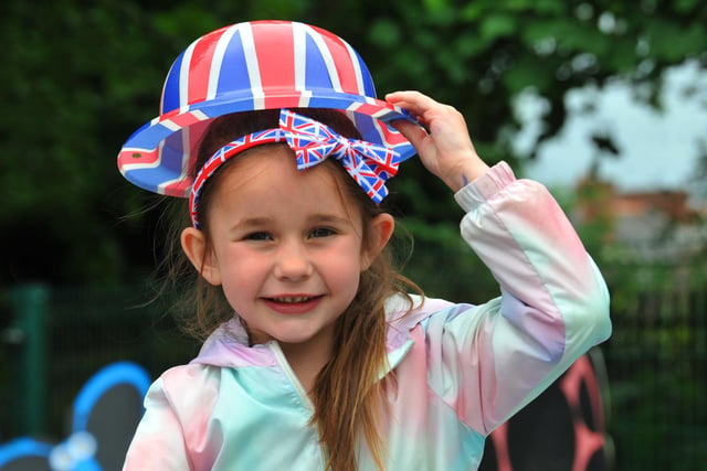 Pupils dress in red, white and blue, surrounded by union flags and bunting, as children sang songs from the 1950s to the 2020s  to celebrate the Queen's platinum jubilee - this was the first opportunity to bring school and local community together since the pandemic at Billinge Chapel End Primary School.