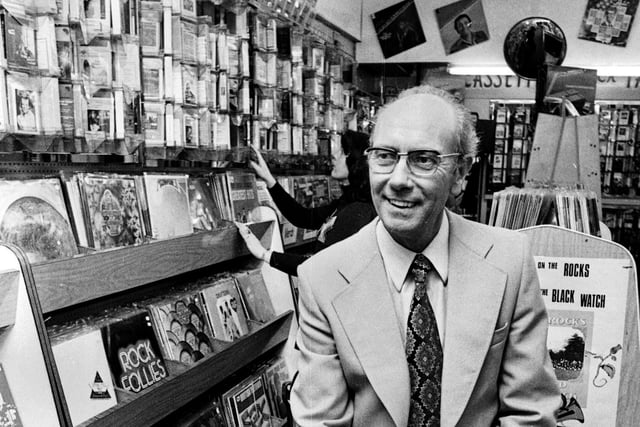 Roy Hurst, who for many years had a record stall in Wigan Market hall, pictured here, in 1976.