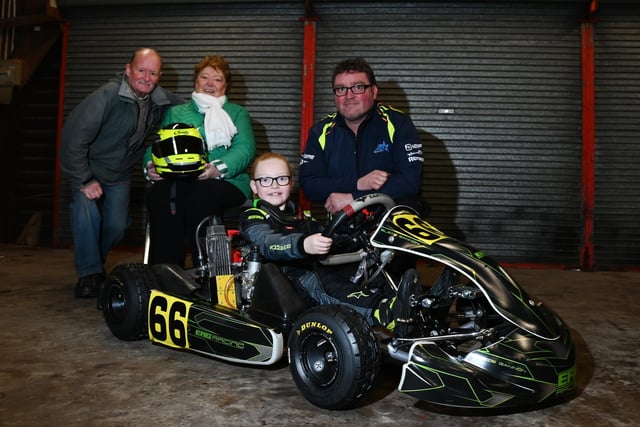Elsie Gannon, nine, from Appley Bridge, pictured with grandparents Colin and Barbara Sellars and Dad Chris Gannon, right,  at Three Sisters Race Circuit, Ashton-in-Makerfield.