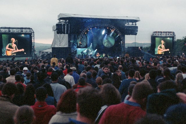 Large screens help those at the back of the crowd see The Verve on stage at Haigh Country Park in front of over 30,000 fans on Sunday May 24 1998.