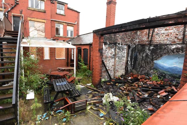 The garden of The Griffin Hotel pub, Standishgate, Wigan - the pub has been closed for years and local business owners claim the derelict building is a magnet for drug users.
