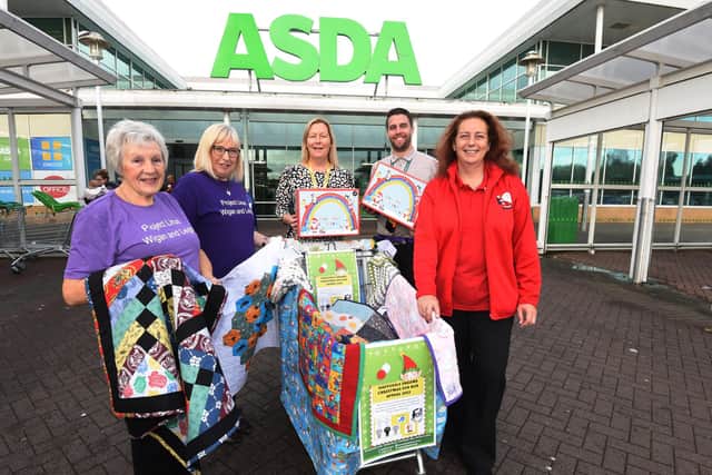 From left, Sue Ince and Barbara Kennedy from Project Linus, who make quilts and blankets, Maureen Holcroft founder of Daffodils Dreams, Asda deputy manager Joe Devlin and Asda community champion Wendy Ainscough, pictured outside ASDA supermarket, one of the drop-off points for donations.