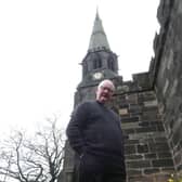 The Reverend Andrew Holliday outside St Wilfrid's Church in Standish