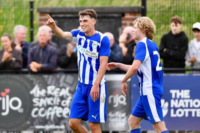 Dara Costelloe celebrates after marking his Latics debut with two goals at Chorley