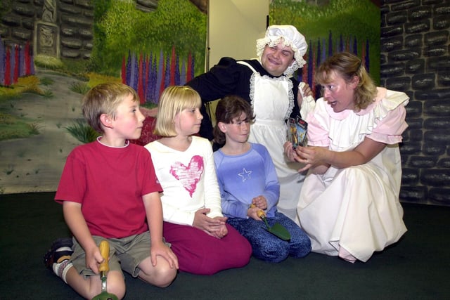 Sharing the secrets of Pendle Productions "The Secret Garden" with Jack Corless aged seven, Kayley Kennedy nine and Saskia Green eight, are the actors Rebecca Davies and Ian Fox whp performed the play at Haigh Hall 2002