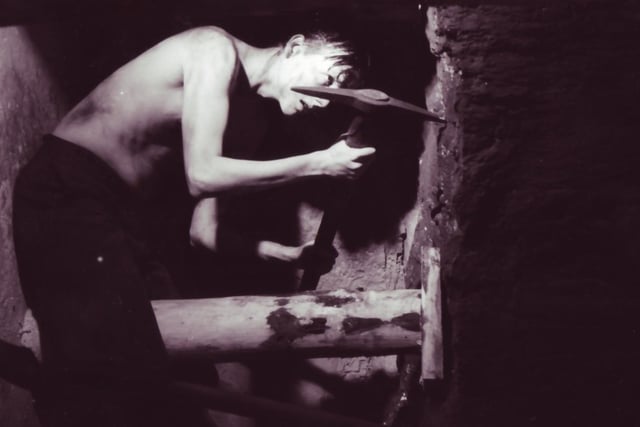 An actor depicting life in the mines in Wigan in The Way We Were centre at Wigan Pier in 1986.