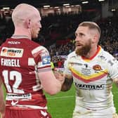 Sam Tomkins and long-time team-mate Liam Farrell embrace after the hooter