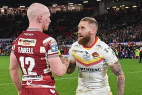 Sam Tomkins and long-time team-mate Liam Farrell embrace after the hooter