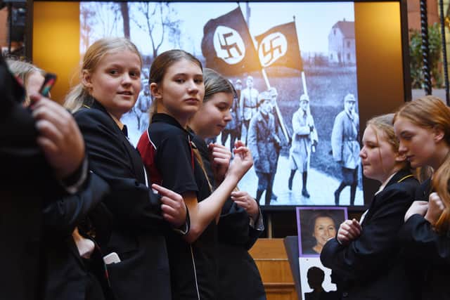 Pupils from St John Fisher High School perform at last year's Holocaust Memorial Day commemoration event at Wigan Town Hall