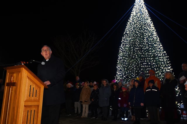 A large tree was lit up during the moving service