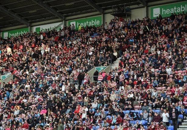 Thousands of Wigan fans (many pictured here at the Super League semi-final against Leigh) will be heading to Old Trafford on Saturday