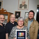 Relatives of the late Wigan veteran Harry Melling, are presented with medals and replicas are put on display, along with other information celebrating the veteran at Wigan Armed Forces Community HQ, Wigan.  From left: Ray Armstrong and Richard Thompson who made the display cabinet, Eileen Melling (niece of Harry), Matthew Melling (his great-nephew) and Charlie Neve, Commander Royal Navy - retired