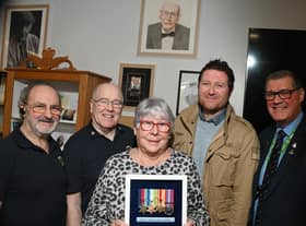 Relatives of the late Wigan veteran Harry Melling, are presented with medals and replicas are put on display, along with other information celebrating the veteran at Wigan Armed Forces Community HQ, Wigan.  From left: Ray Armstrong and Richard Thompson who made the display cabinet, Eileen Melling (niece of Harry), Matthew Melling (his great-nephew) and Charlie Neve, Commander Royal Navy - retired