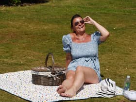 Rebecca Hitchen enjoys sunshine on her lunch break at Mesnes Park, Wigan.