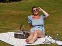 Rebecca Hitchen enjoys sunshine on her lunch break at Mesnes Park, Wigan.