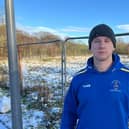 Andy Irving next to the site where Standish homes are planned