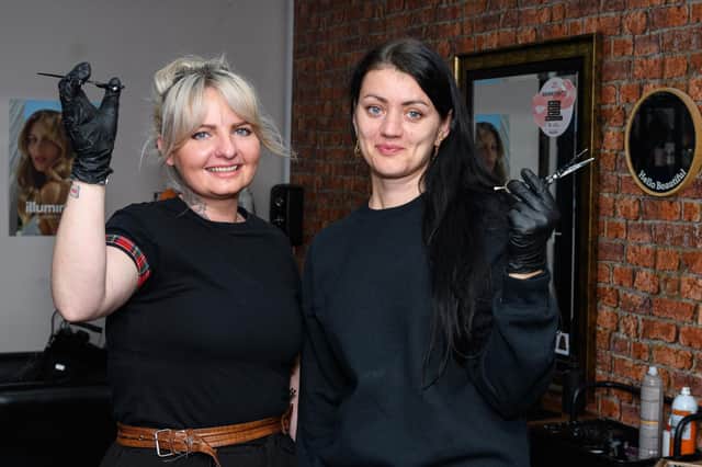 Owner Joanna Cottam has taken in Ukranian refugee Inna Hashynska to work at her salon The Haus of Hair in Wigan. Photo: Kelvin Stuttard