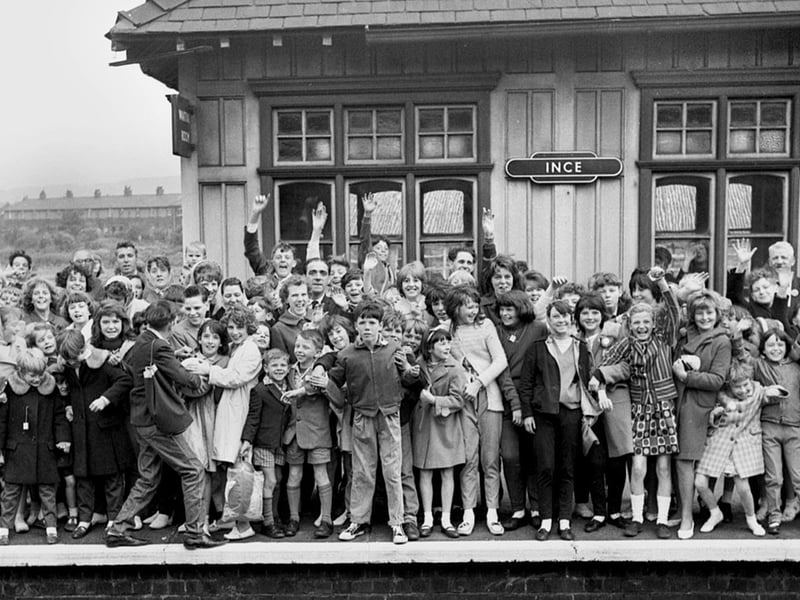 A crowded platform at Ince railway station as a happy crowd wait for the train to take them on a day trip in the 1960s.