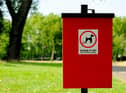 A sign asking owners to clean up after their dog