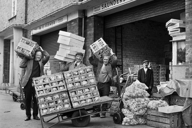 Unloading goods for Saunders fruit merchants at Wigan market hall in 1969.
