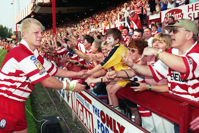 Mick Cassidy with fans after the match.