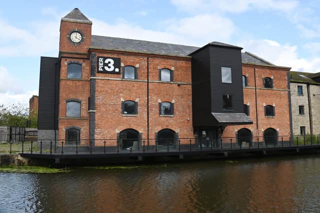 The clock in the tower at the former Orwell pub building at Wigan Pier before it was stolen