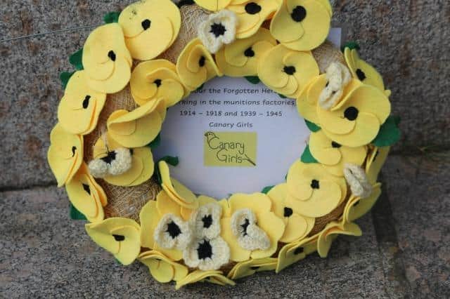 A yellow wreath laid to honour the forgotton heroes, the Canary Girls, who worked at the munitions factories during WW1 and WW2.