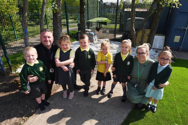 Teacher Scott Beardsworth, left, with Marsh Green Primary School pupils at acting early years lead Michelle Bohannan, second from right