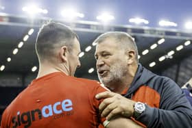 England coach Shaun Wane (r) congratulates Harry Smith after victory over Tonga.