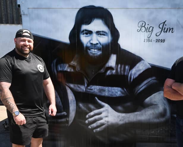 From left, Alex Melling, owner of Baldy's Pies, commissioned Scott Wilcock, right,  known as Snow Graffiti, to create a tribute to his dad, Jim Melling, who was a rugby pro and an inspiration to Alex