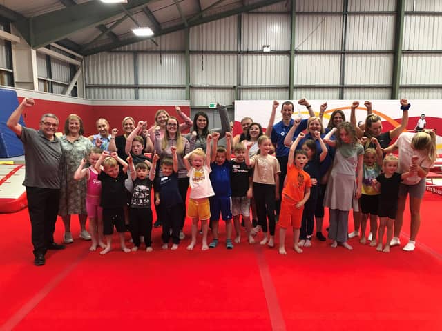 Councillors Chris Ready and Jenny Bullen (far left) with kids at a HAF activity camp at Robin Park Leisure Centre last summer