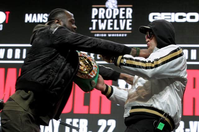 Deontay Wilder (L) and Tyson Fury get into an altercation during their press conference at the MGM Grand Las Vegas (Photo: JOHN GURZINSKI/AFP via Getty Images)